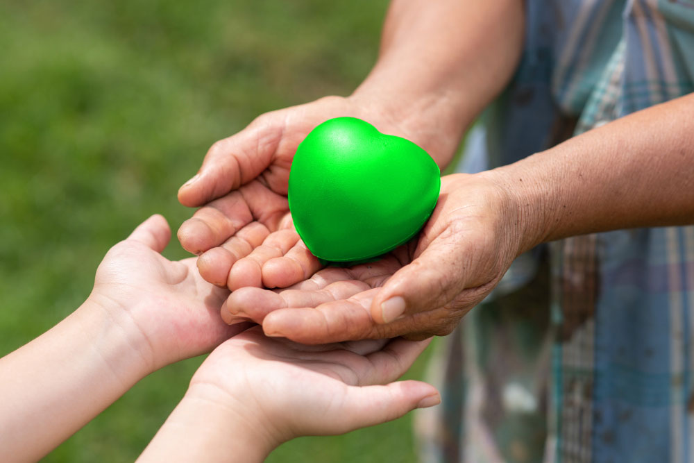 Charity workers handing hearts to each other after getting SEO Optimisation