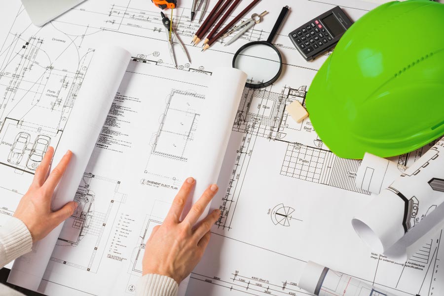 Construction worker going over plans after SEO Optimisation
