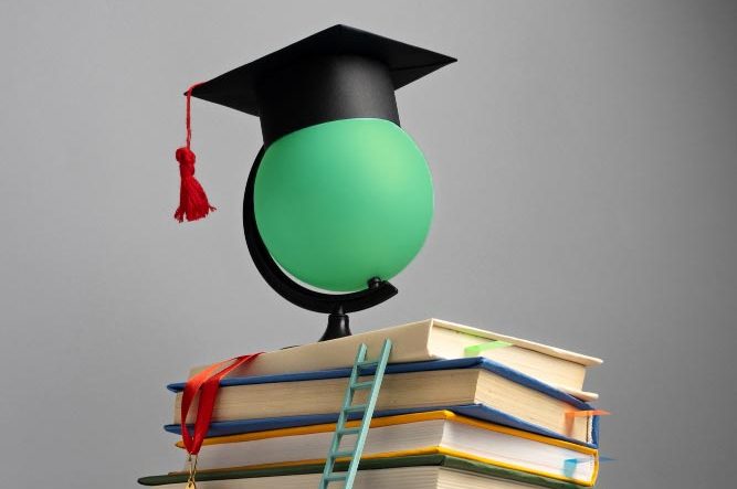 Education industry doing work with a globe and books after getting SEO Optimisation
